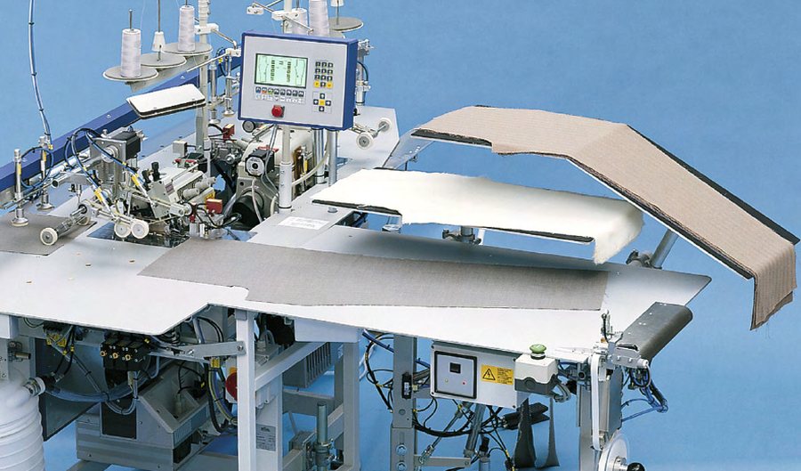 Unidad automática de sobrehilado para piezas de pantalón